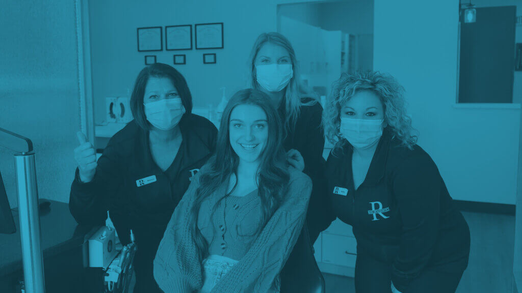 ross orthodontics staff with patient
