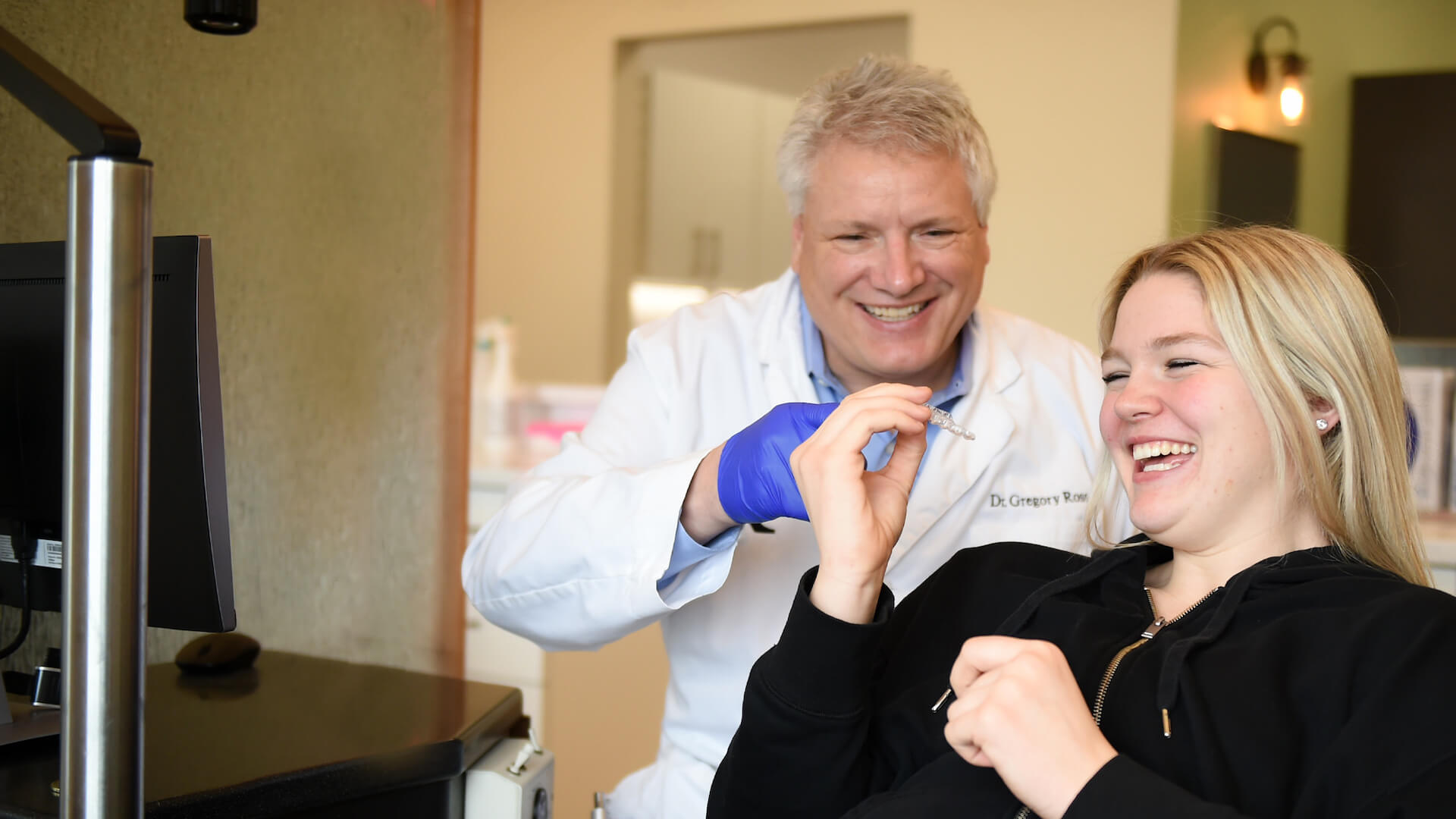 dr. ross with smiling patient