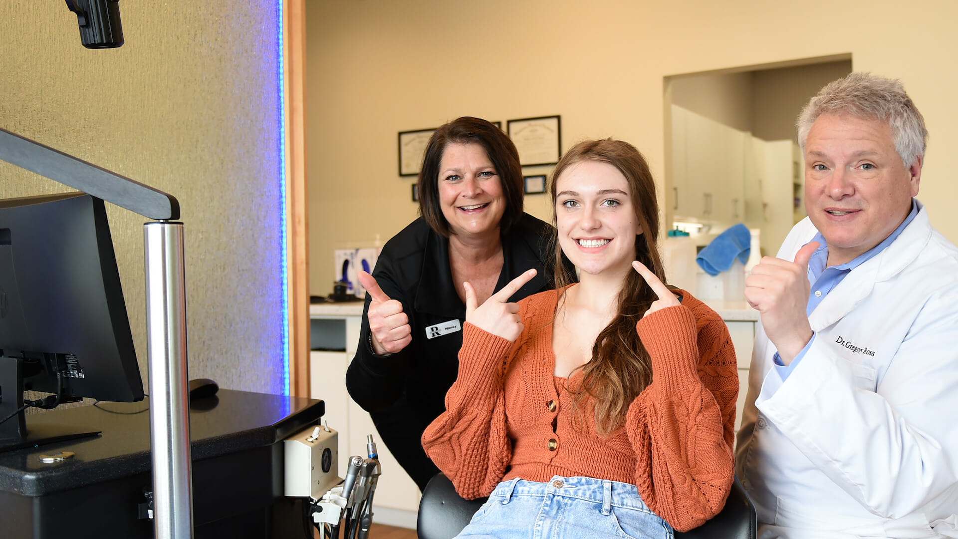 dr. ross with patient smiling